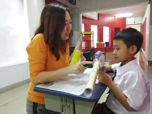 A student of Sekolah Victory Plus - the renowned International Baccalaiureate School in Indonesia is practising active listening skill with his mother
