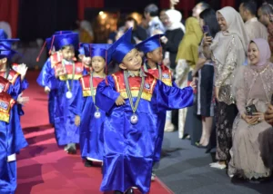 Early Years 2 students of Sekolah Victory Plus, an International Baccalaureate School in Indonesia, cheerfully entering the hall during the Certificate Presentation.