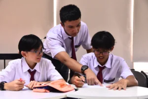 Students of Sekolah Victory Plus, an International Baccalaureate school in Indonesia, studying in the classroom.