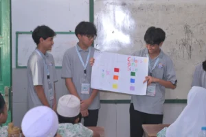 Students of Sekolah Victory Plus, an International Baccalaureate School in Indonesia, teaching students in Muara Angke for the Service as Action project.