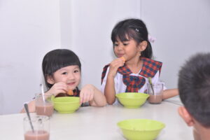Two students of Sekolah Victory Plus, an international school in Bekasi, learn happily at school.