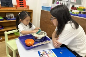 A parent and a child doing an experiment for inquiry together.