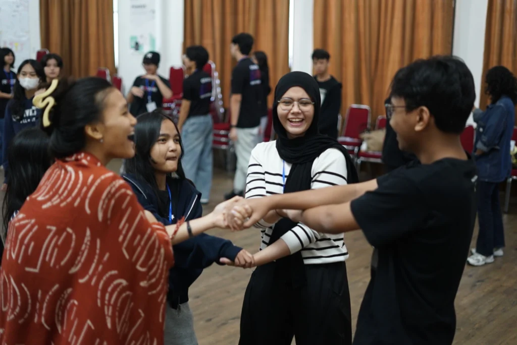 Students playing in a group activity during the leadership camp for Learning Beyond the Walls.