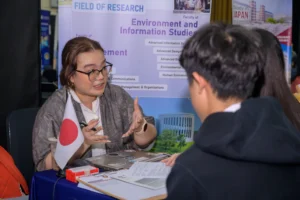 A university admission team sharing information with students during the University Fair at Sekolah Victory Plus.